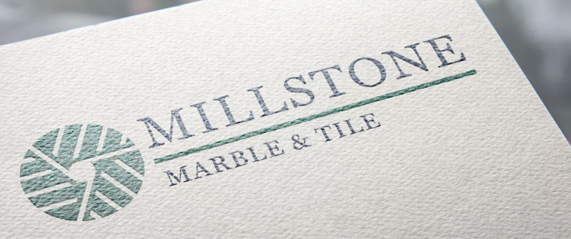 The final logo rendered on textured card stock